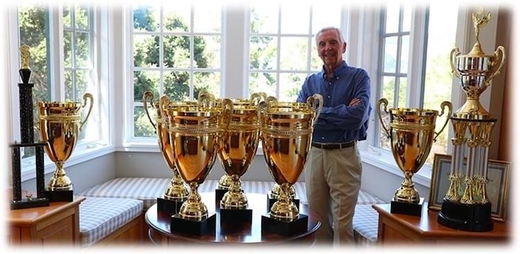 Chuck with trading trophies