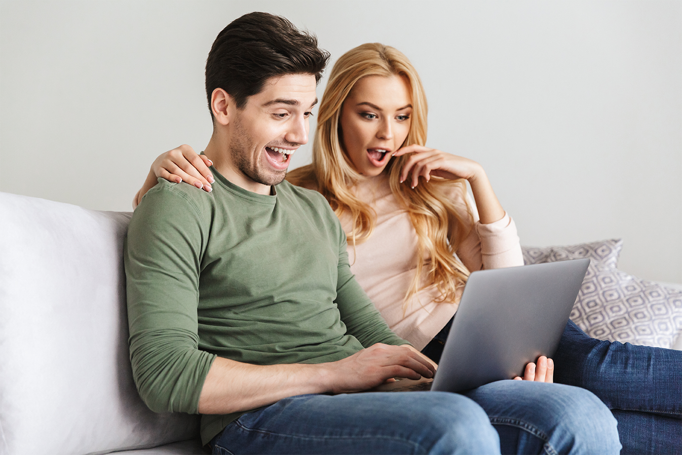 Couple looking at a laptop screen